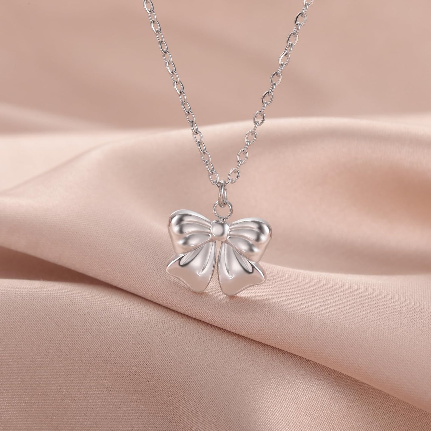 kkjoy Cute Small Tiny Bow Necklace Stainless Steel Silver Plated Dainty Ribbon Bow Tie Pendant Necklace Butterfly Bowknot Jewelry for Women Charming Ladies (Style 2, Silver)